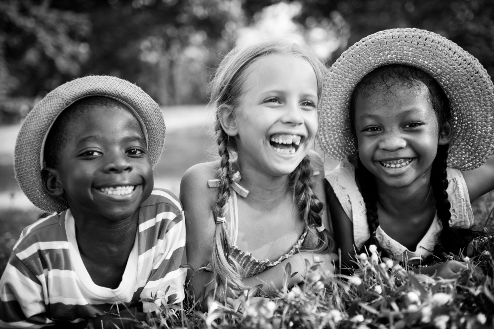 Smiling children holding hands